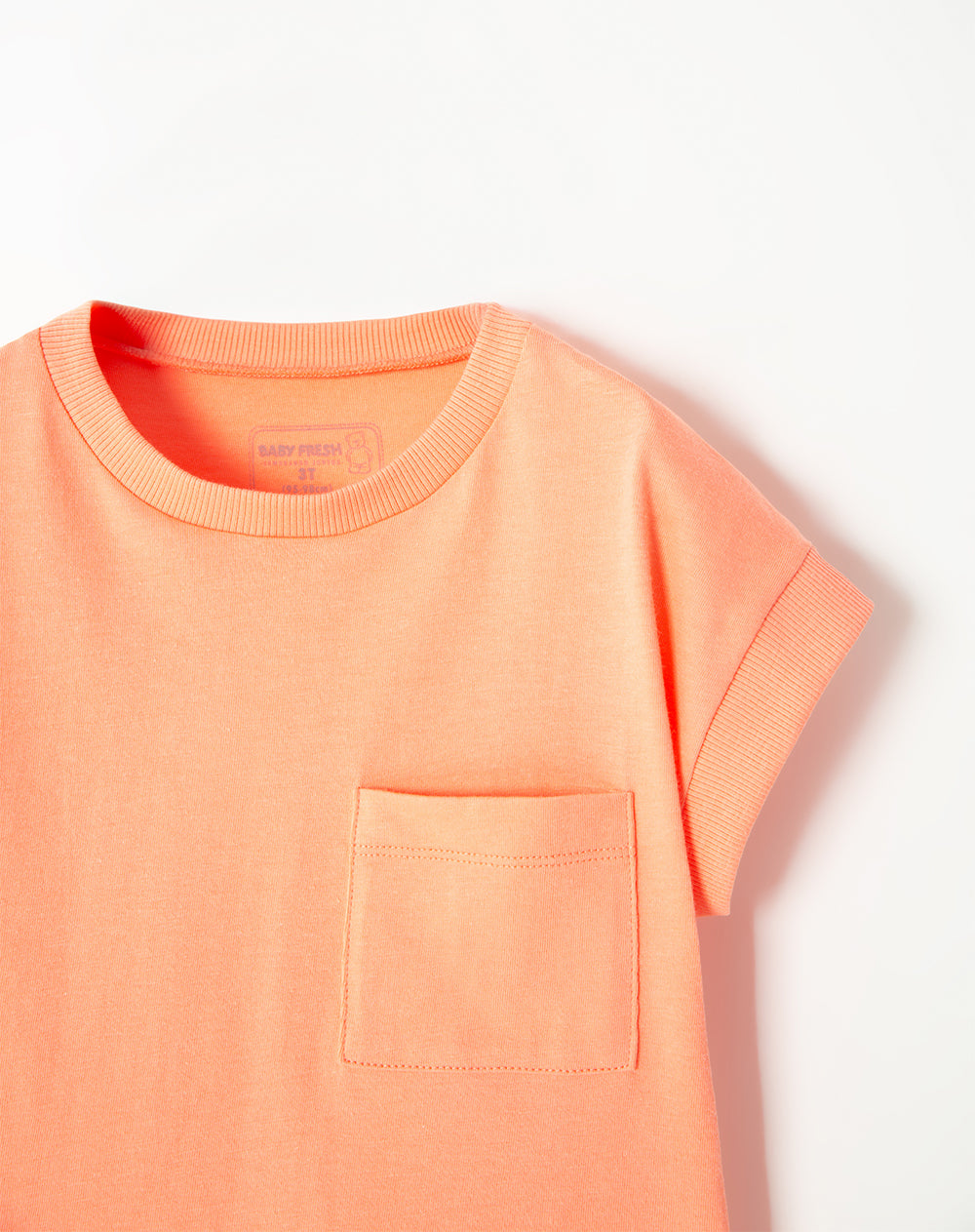 Camiseta oversized fit manga corta coral